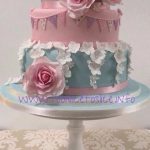 Vintage style wedding cake with roses & bunting