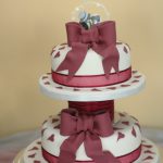 Burgundy bows & hearts wedding cake, Lytham St Annes, Lancashire